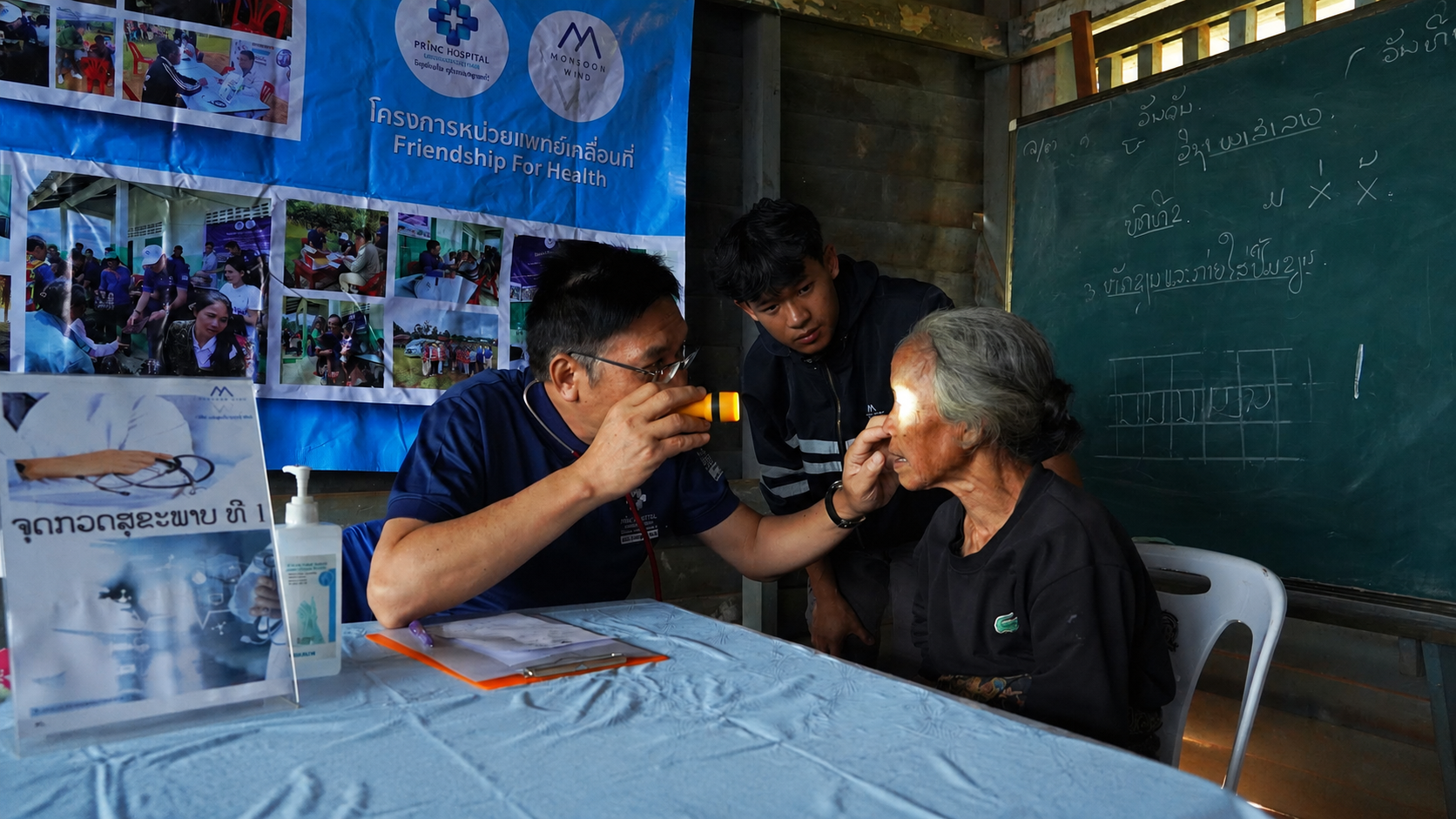 A doctor providing an eye examination during mobile medical outreach